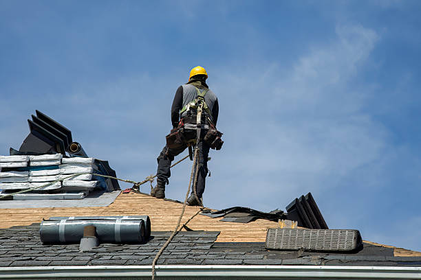 Professional Roofing technician working in Ypsilanti, ND